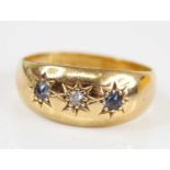 An Edwardian 18ct gold sapphire & diamond set band ring, the round cut stones each being gypsy