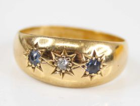 An Edwardian 18ct gold sapphire & diamond set band ring, the round cut stones each being gypsy