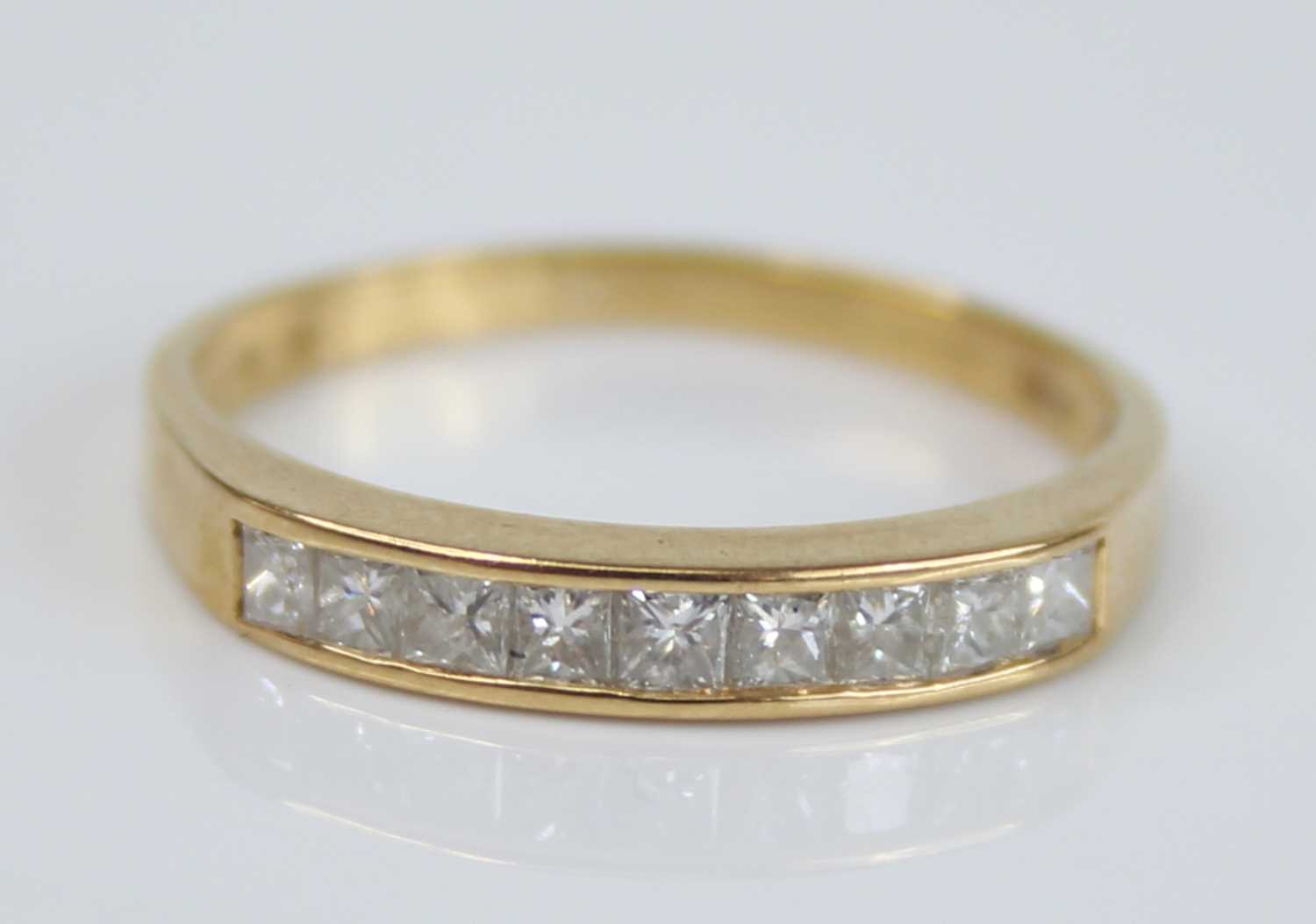 A modern 18ct gold diamond half hoop ring, arranged as seven channel set princess cuts, total - Image 2 of 7