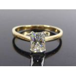 An 18ct yellow and white gold, synthetic moissanite solitaire ring, featuring a radiant cut
