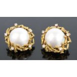 A pair of 18ct yellow gold mabé pearl and diamond clip earrings, each featuring a 15.35mm mabé pearl
