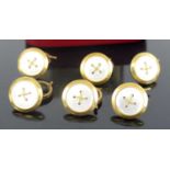 A set of six yellow metal circular dress studs, with mother of pearl inlay and cross detail to the