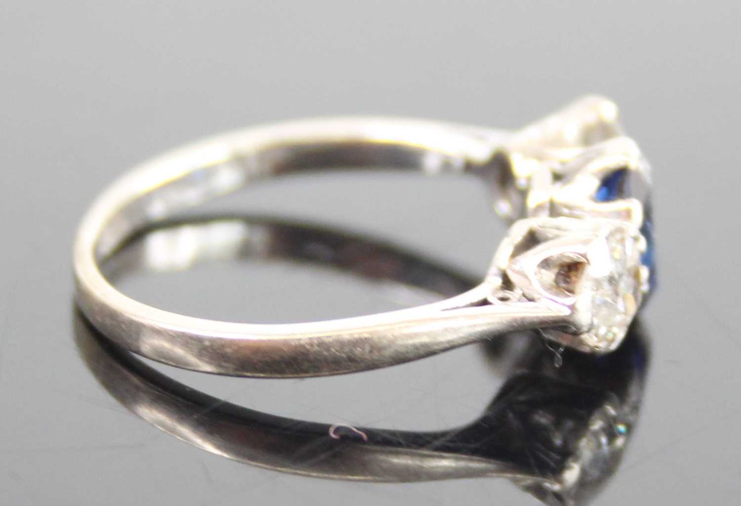 A white metal, sapphire and diamond three-stone ring, featuring a centre oval sapphire with an Old - Image 3 of 7