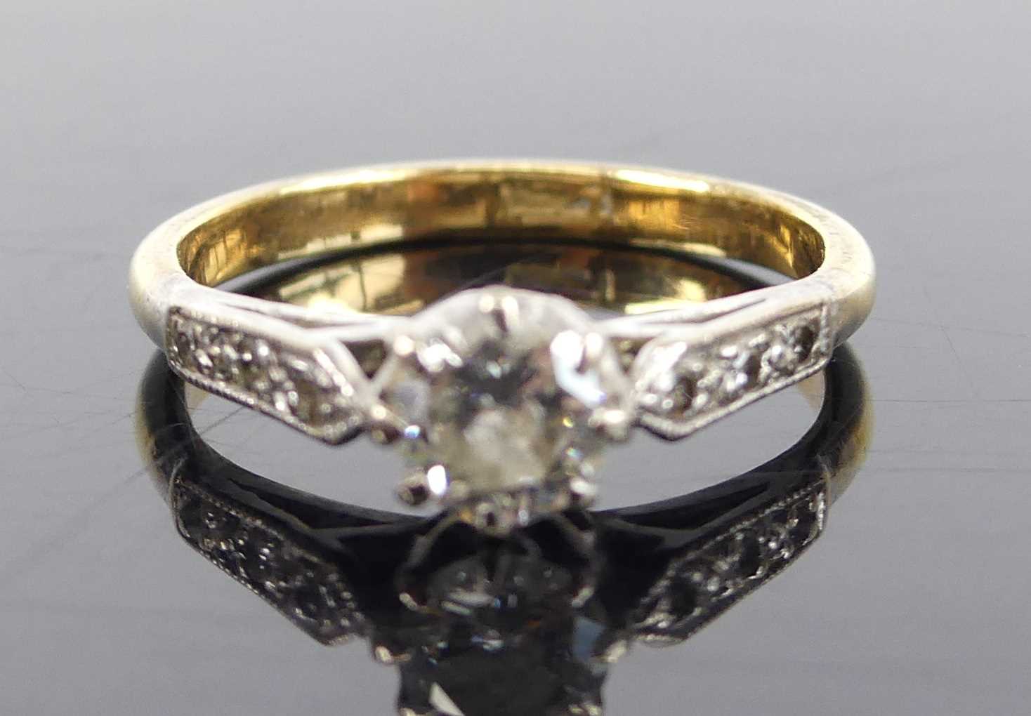 A yellow and white metal, diamond solitaire ring, featuring a round brilliant cut diamond in an - Image 2 of 7