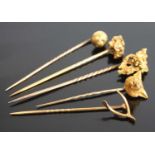 Five assorted yellow metal stick pins to include a fox head with rose cut diamond eyes. Length 50mm,