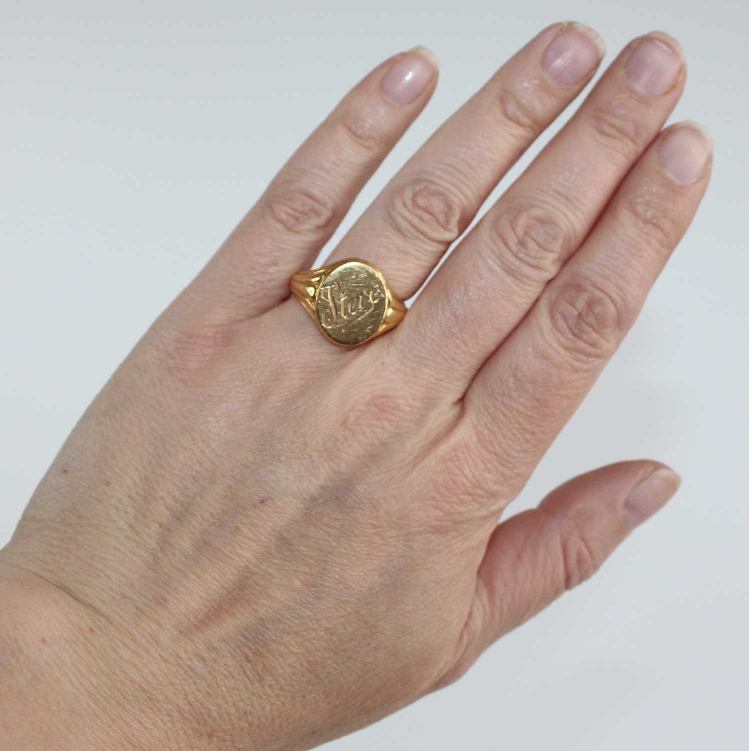A yellow metal gent's signet ring, the oval top signed Steve, with tapering fluted shoulders, - Image 6 of 6