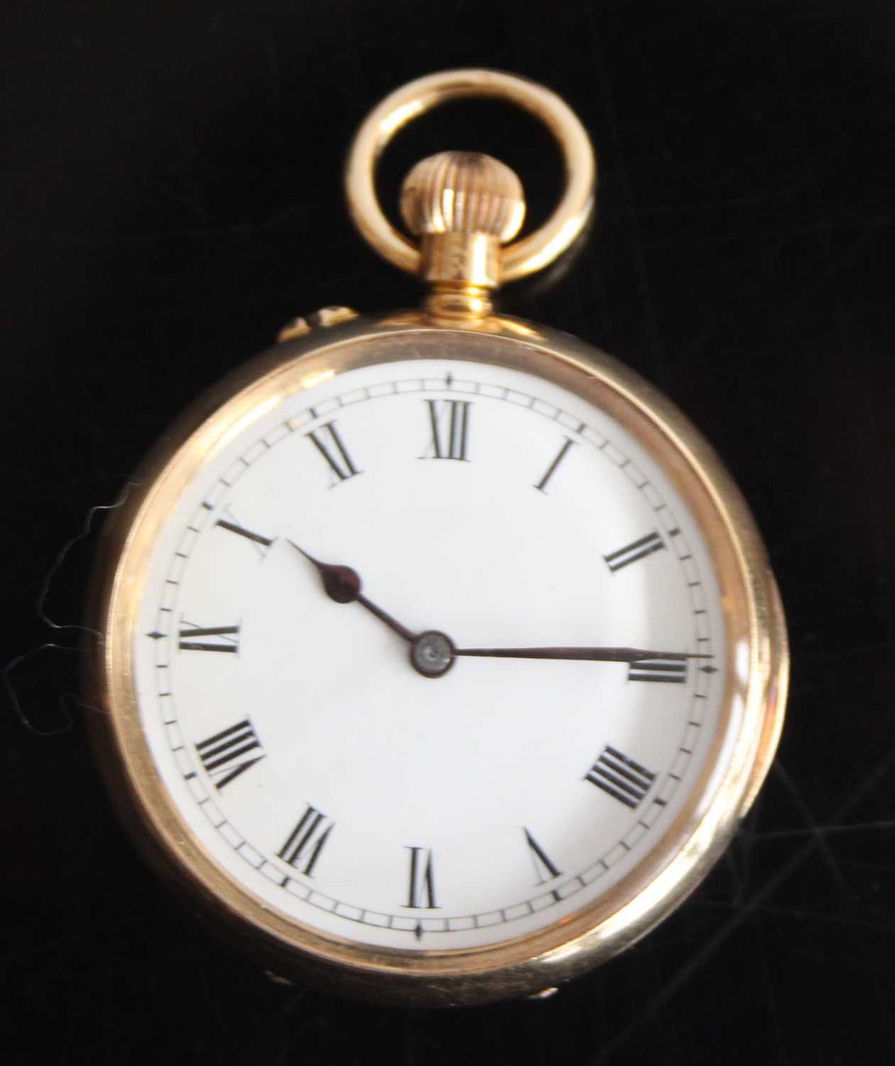 An 18ct gold keyless open faced pocket watch with round white Roman dial and case back engraved with