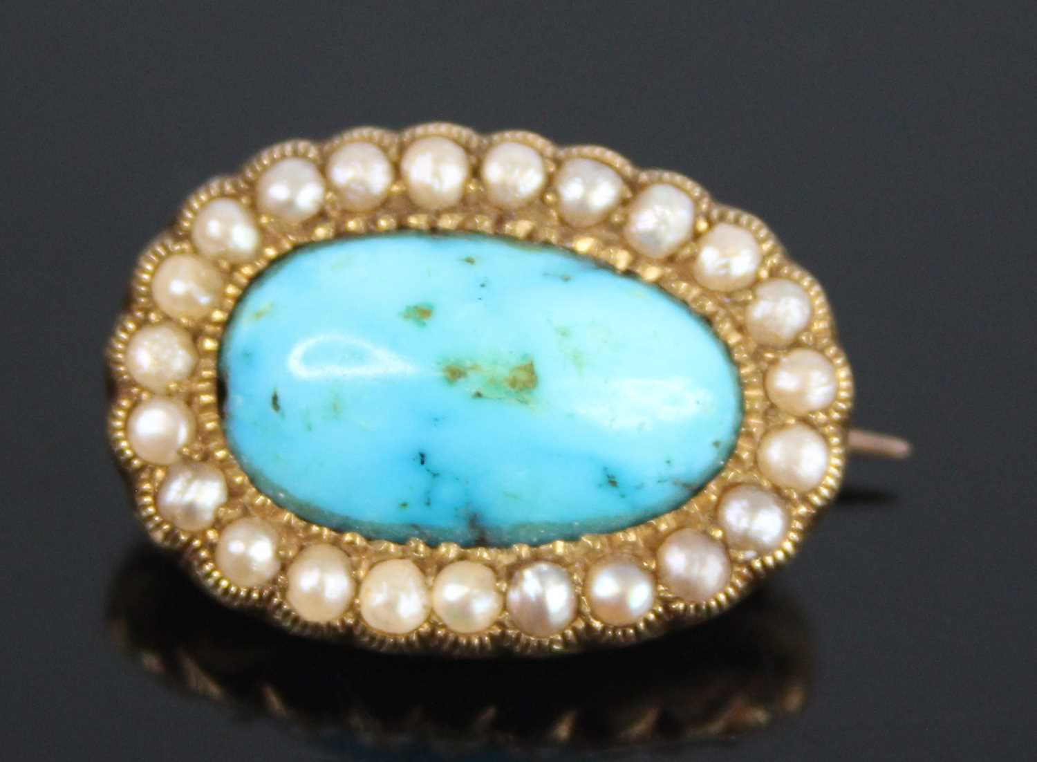 A yellow metal, turquoise and pearl oval cluster brooch, comprising a centre 14.78 x 9 x 5.55mm oval