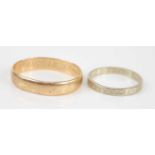 A yellow metal wedding band, inscribed to the inside, unmarked but tests as approx 14ct gold, 4.