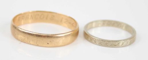 A yellow metal wedding band, inscribed to the inside, unmarked but tests as approx 14ct gold, 4.
