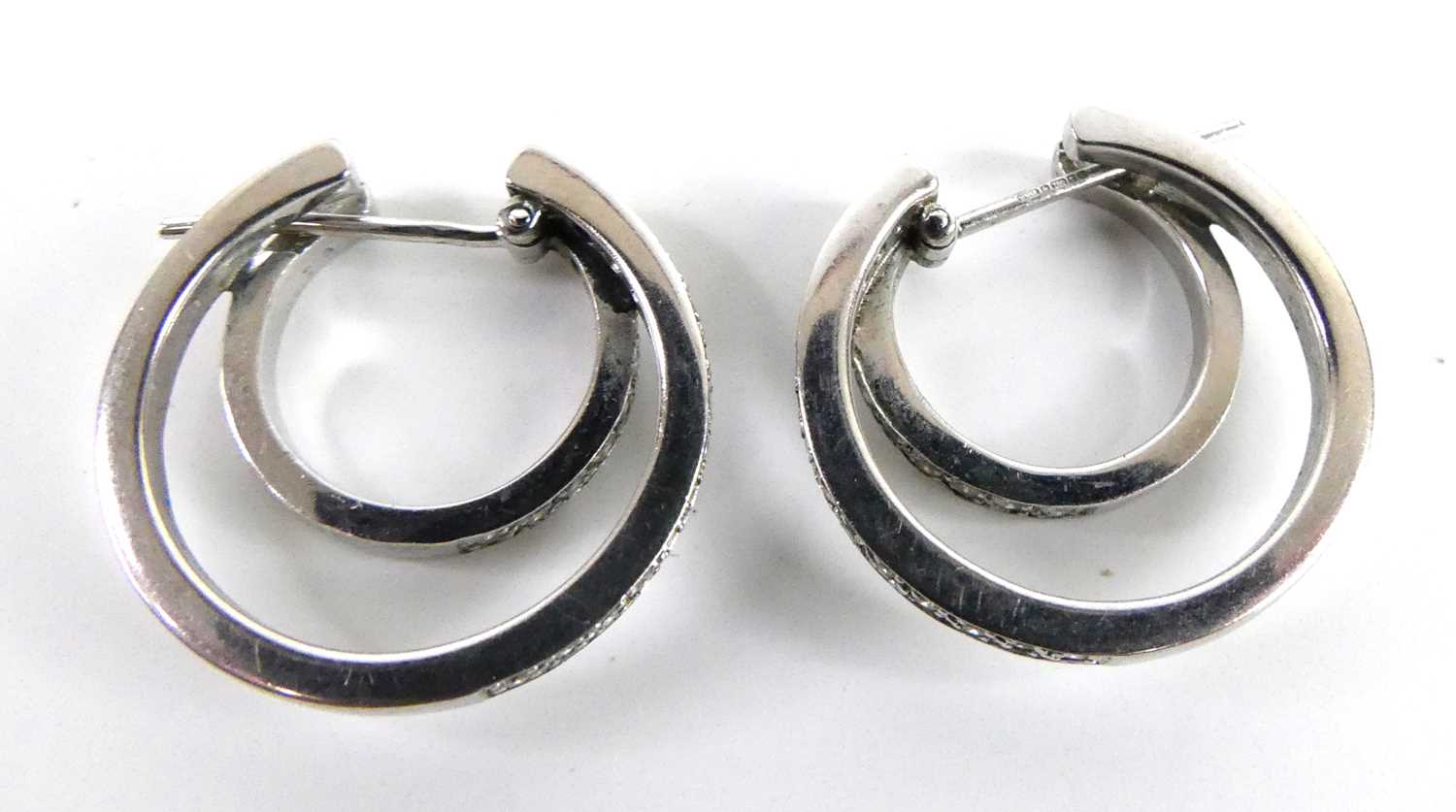 A pair of 18ct white gold diamond double hoop earrings, each featuring an inner hoop with ten and an - Image 3 of 4