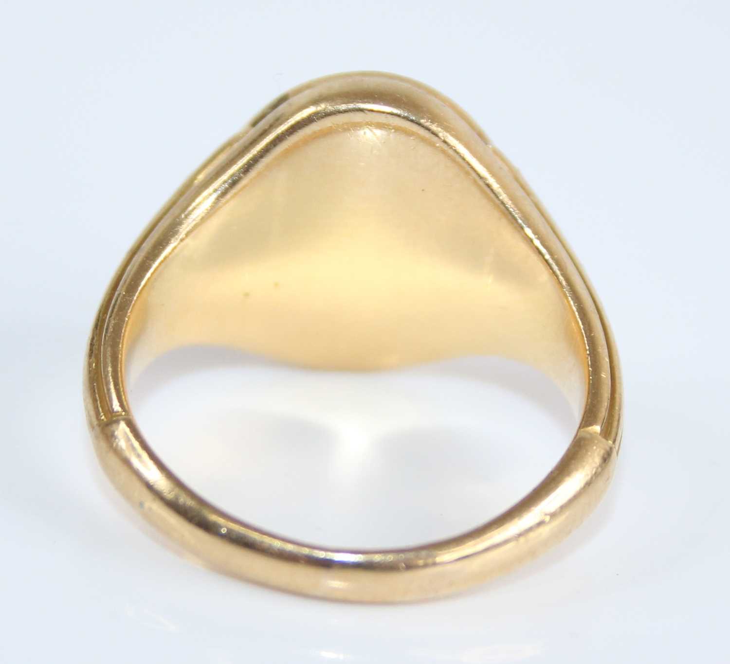 A yellow metal gent's signet ring, the oval top signed Steve, with tapering fluted shoulders, - Image 3 of 6