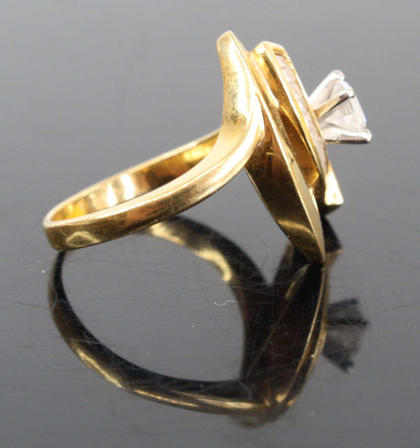 A modern 18ct gold diamond dress ring arranged as a four claw set brilliant, weighing approx 0.3ct - Image 4 of 4