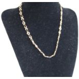 A yellow metal fancy link necklace, stamped 375 and tests as approx 9ct gold, 5.1g, length 38cm