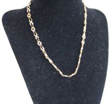 A yellow metal fancy link necklace, stamped 375 and tests as approx 9ct gold, 5.1g, length 38cm