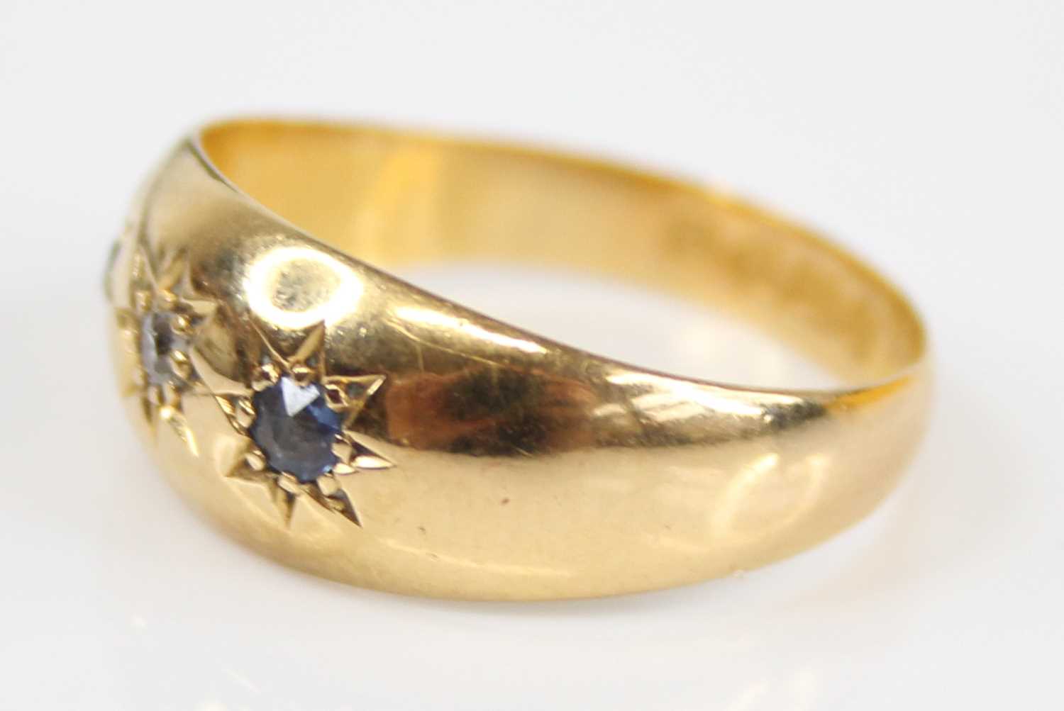 An Edwardian 18ct gold sapphire & diamond set band ring, the round cut stones each being gypsy - Image 4 of 7