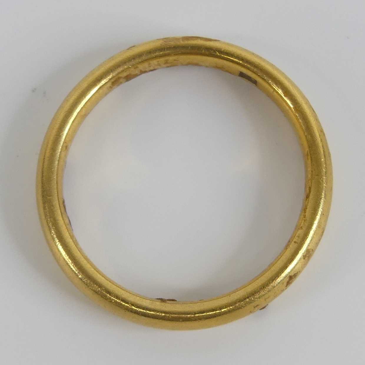A yellow metal 3.2mm court shaped wedding band, size approx N, gross weight 5.6g, stamped and tested - Image 5 of 6