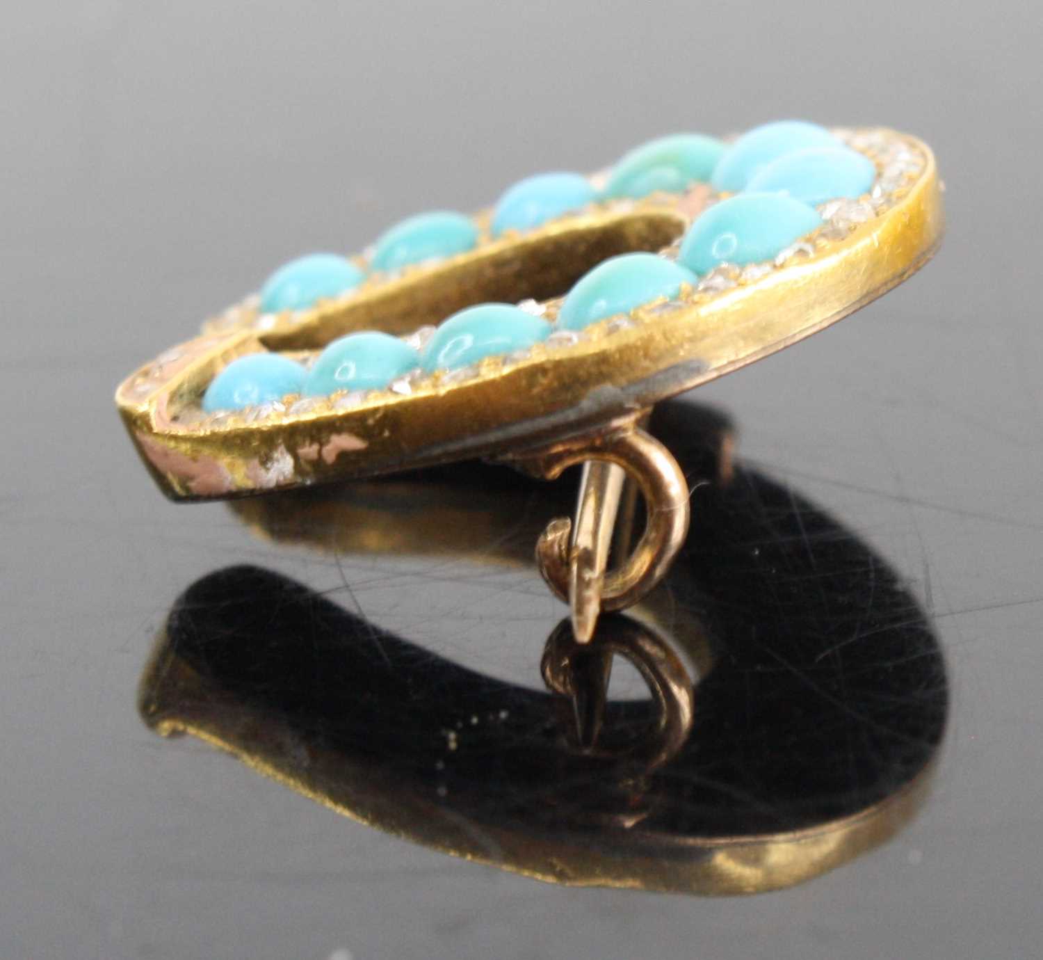 A yellow metal turquoise diamond highlight set horseshoe brooch arranged as 11 graduated turquoise - Image 2 of 3