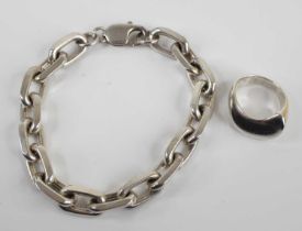 A modern silver chain link bracelet 19cm, together with a modern silver dress ring, size K, gross