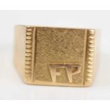 A French 18ct gold gent's signet ring, the textured square top with carved initials FP, with eagle
