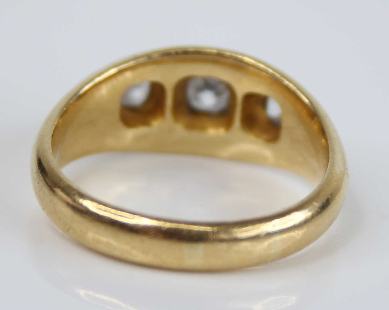 A gent's 18ct gold diamond three-stone ring, the flush set graduated old cushion cuts total weight - Image 3 of 5