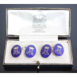 A pair of gilt metal double ended cufflinks, the oval plates with blue enamel inlay and M monogram