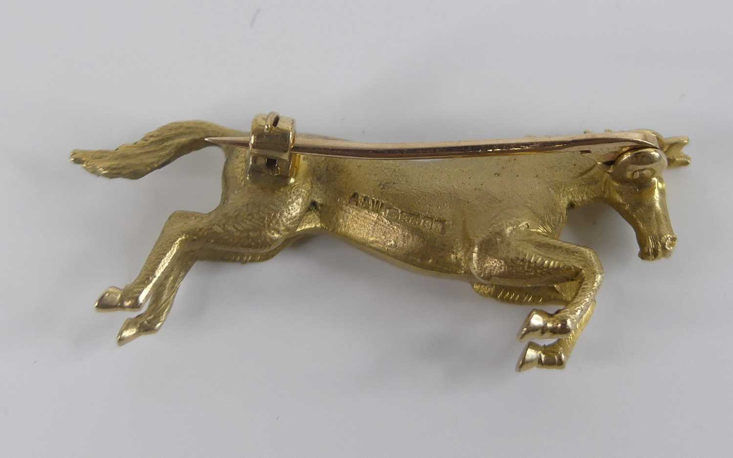 A 9ct yellow gold prancing horse brooch, with roller catch fastening, brooch length 36mm, gross - Image 3 of 4