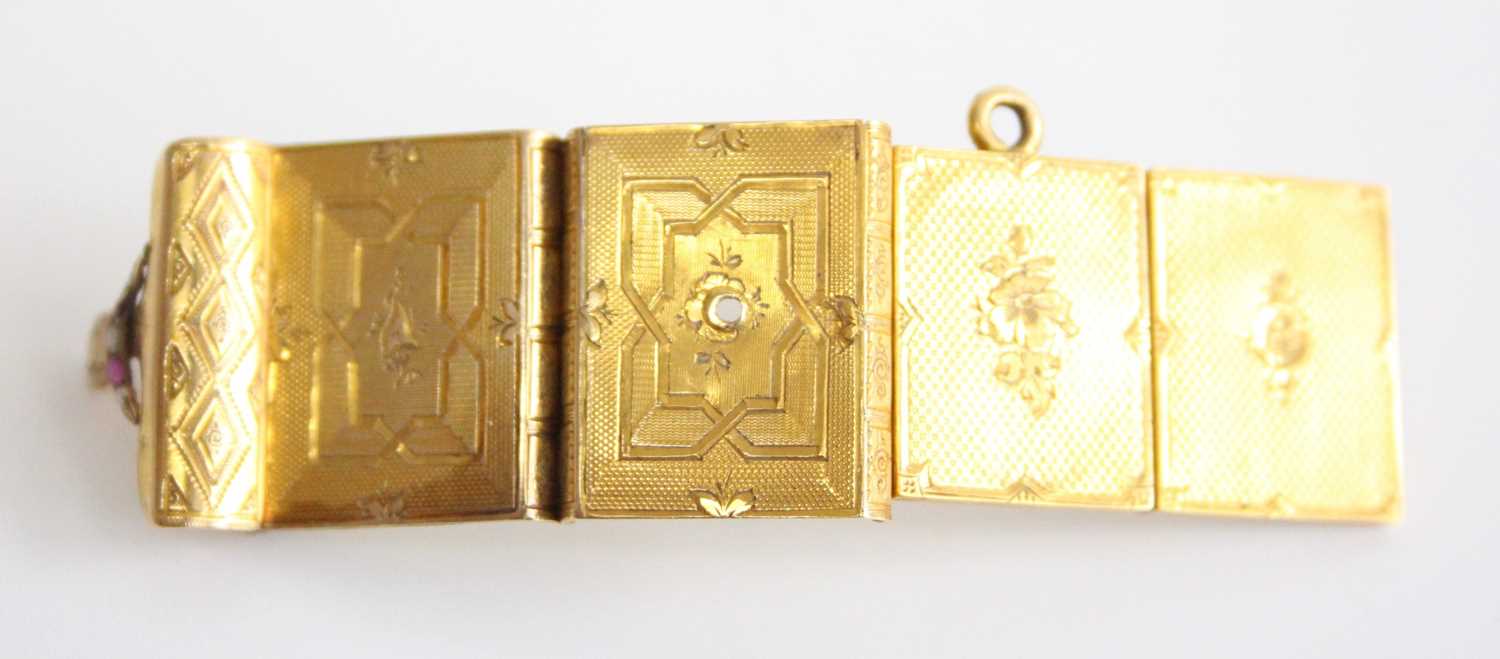 A late 19th century pendant locket in the form of a book, having concertina action to allow four - Image 3 of 5