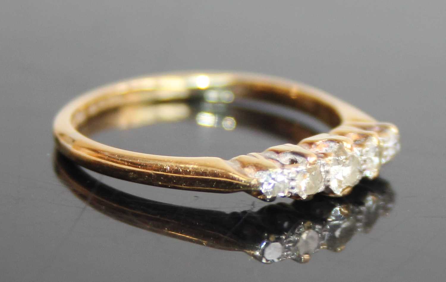 An 18ct gold and platinum diamond half hoop ring, arranged as five claw set graduated round cuts, - Image 2 of 7