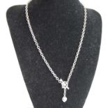 A contemporary 9ct white gold chain link necklace, with T bar clasp and heart shaped pendant, 7.