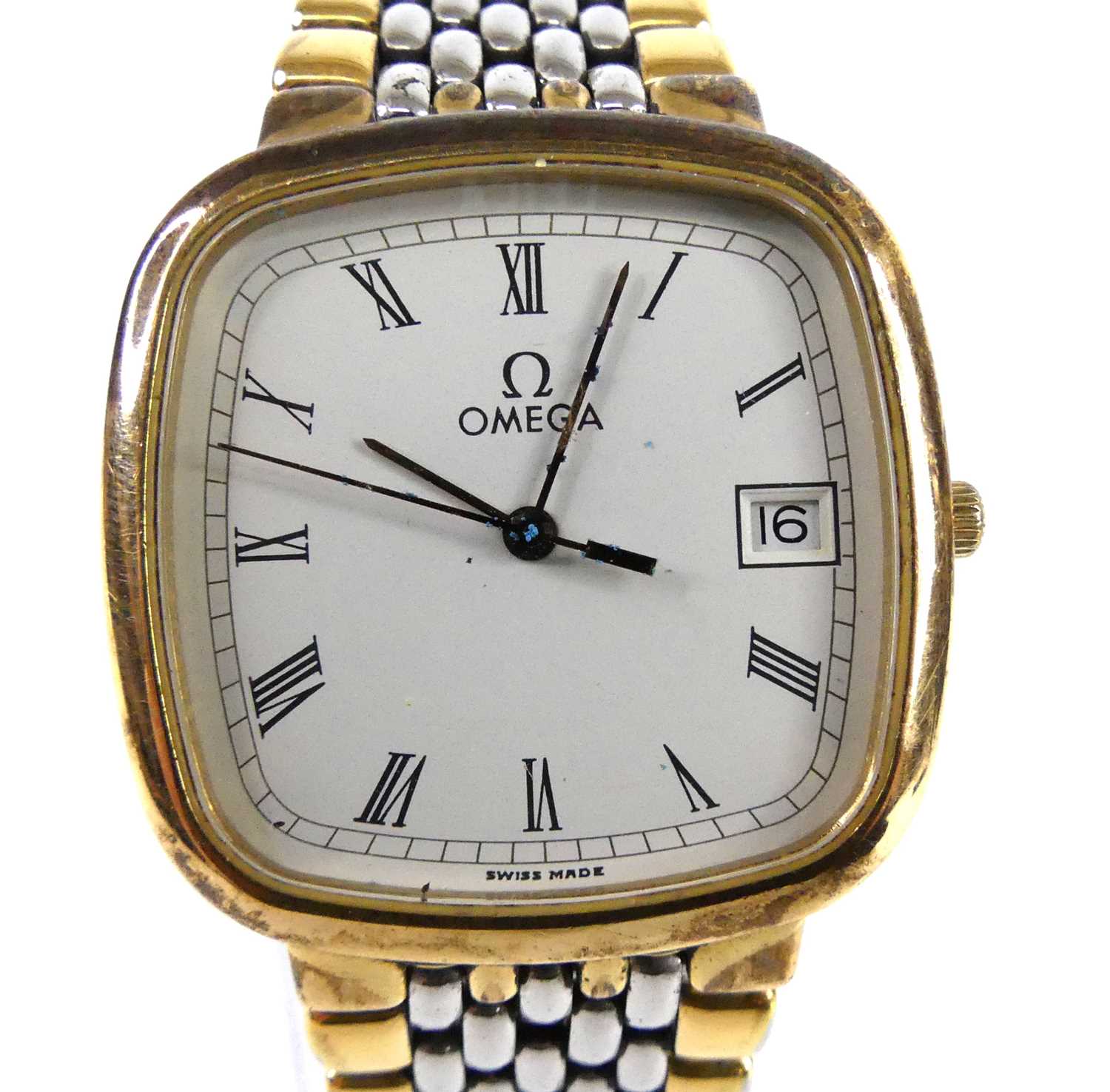 A lady's Omega de Ville bi-metal quartz watch, with cushion shaped cream Roman dial and date at 3,
