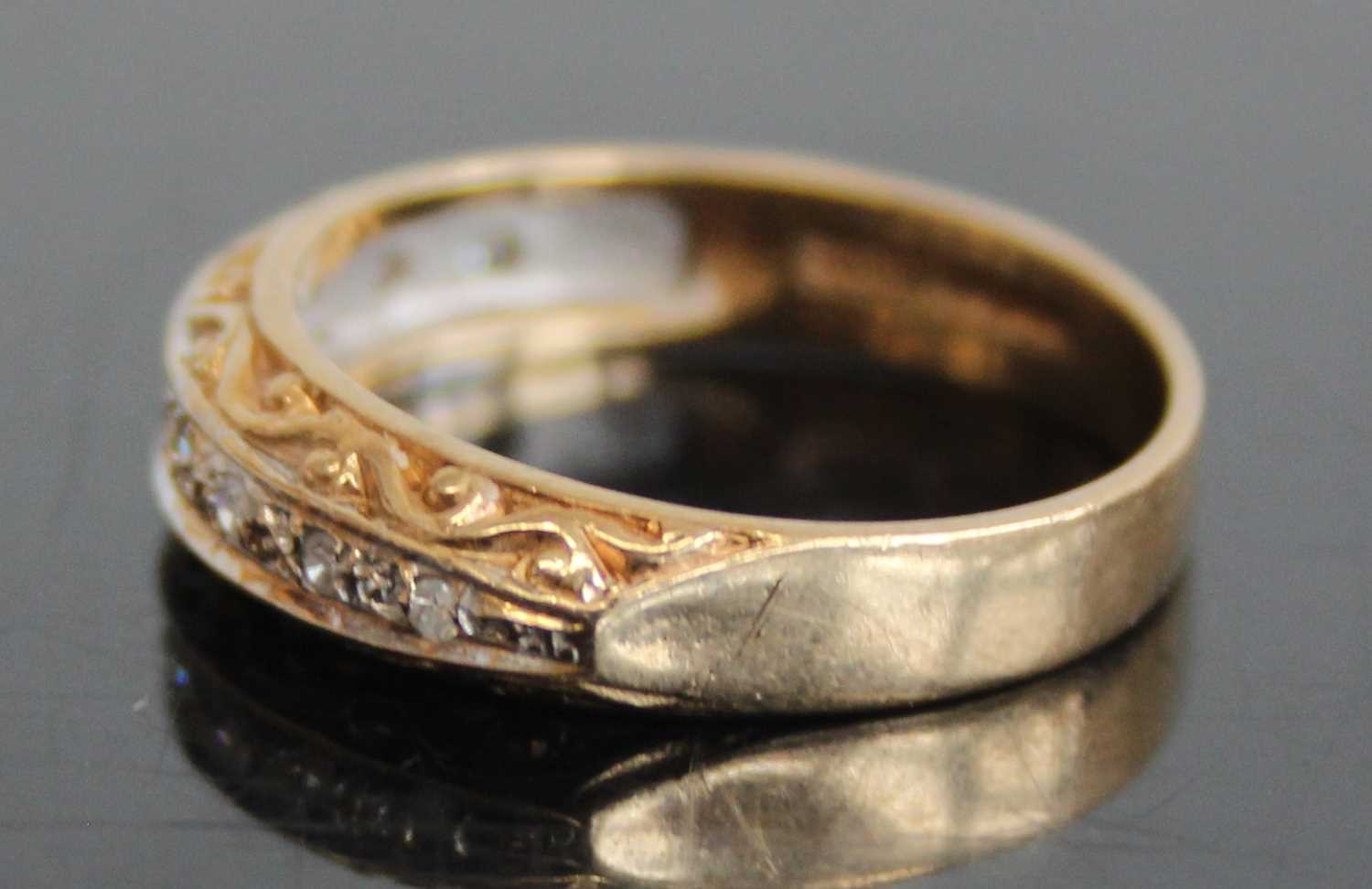 A 9ct gold diamond half eternity ring, arranged as nine small round cuts in a carved setting, - Image 4 of 7