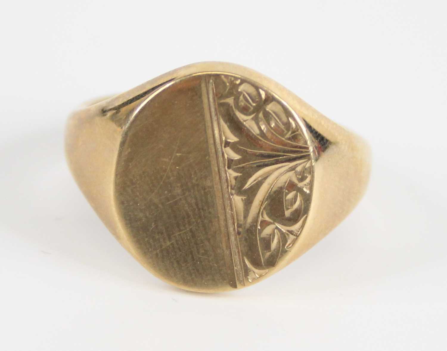 A gent's 9ct gold signet ring, having half engraved bezel, 8.5g, Birmingham 1975, sponsor EJ Ltd,