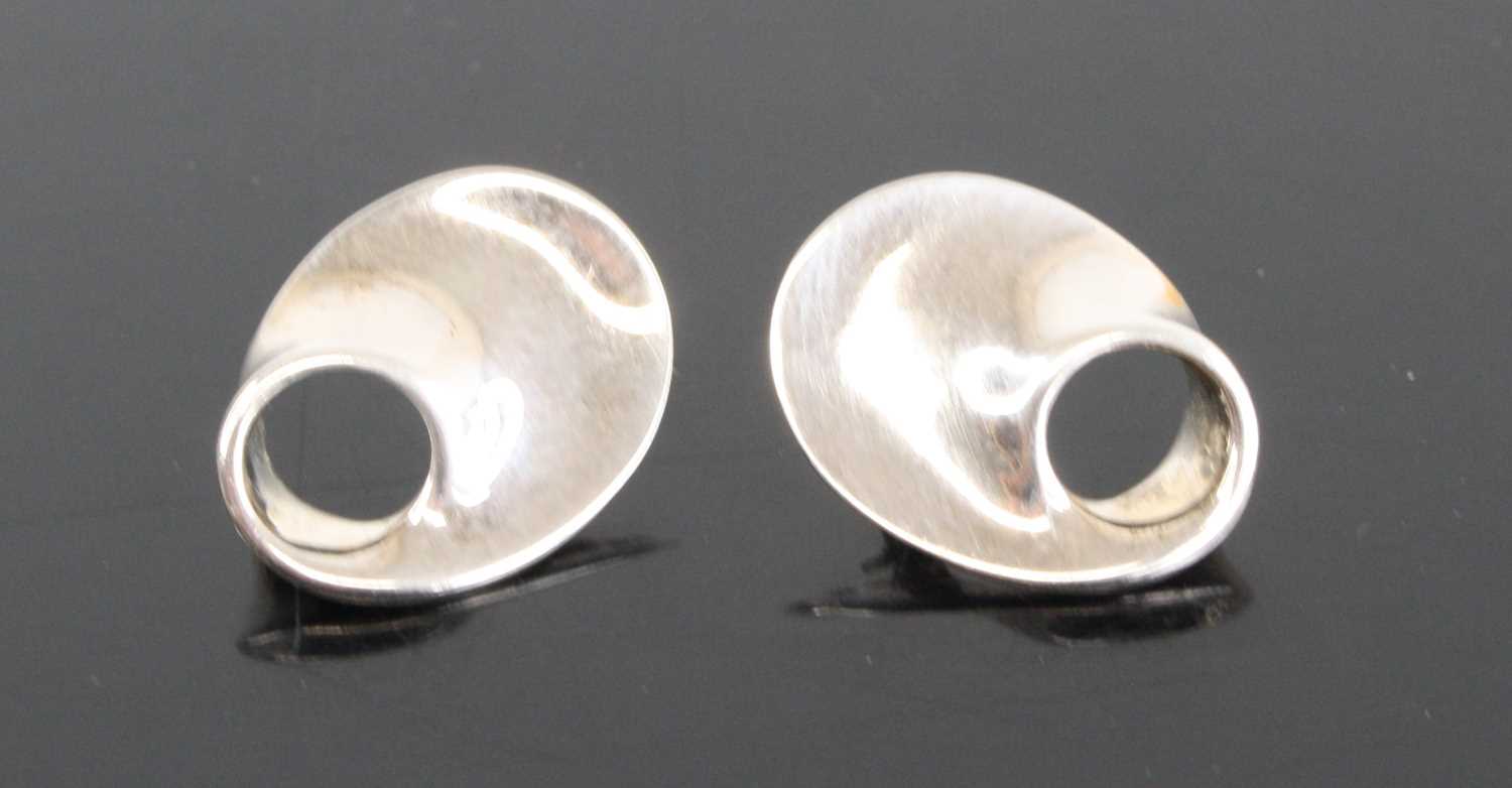 A pair of silver ear studs designed by Vivianna Toran for Georg Jensen, both stamped and numbered