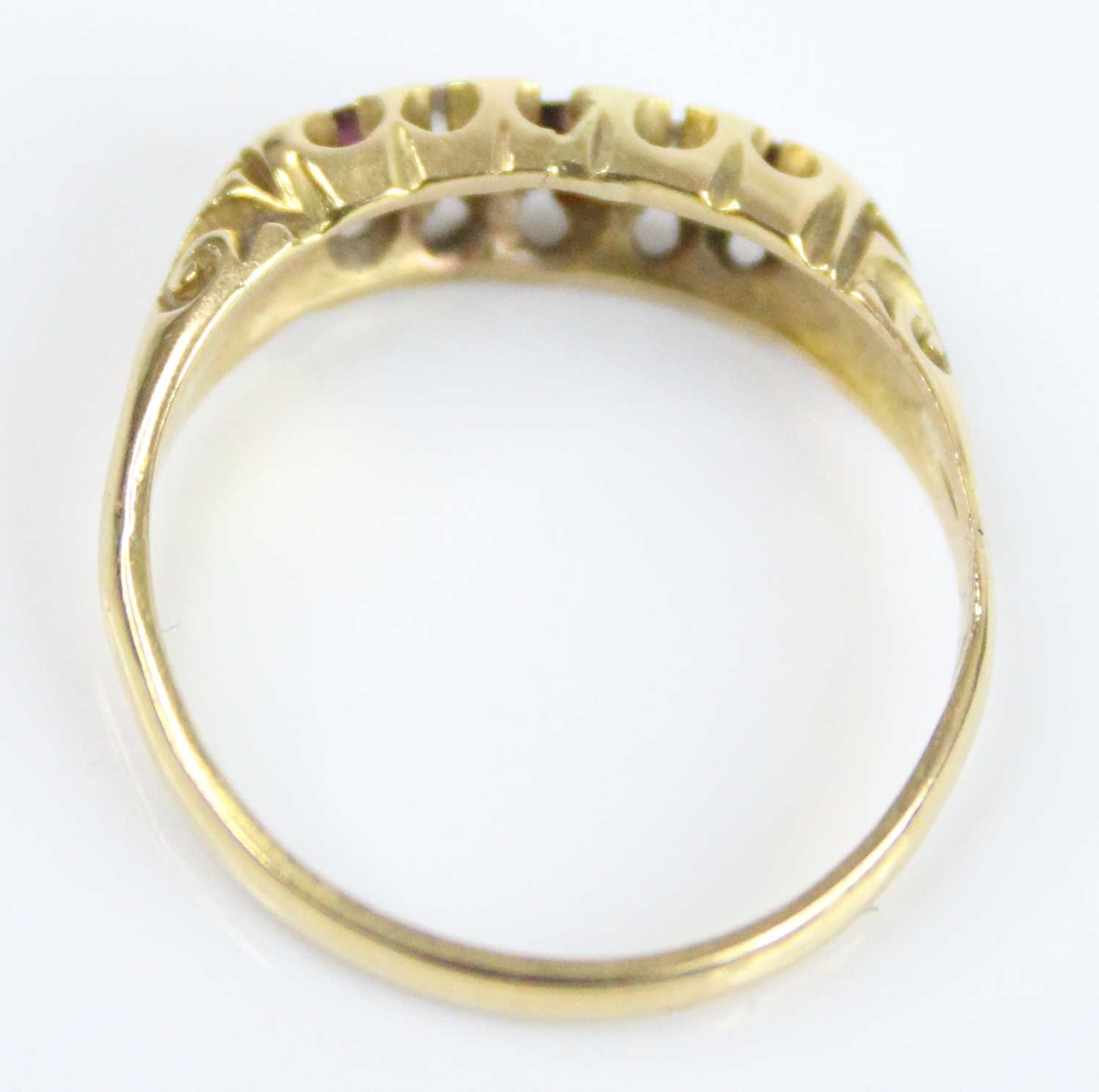 A yellow metal, garnet, diamond and ruby half hoop eternity ring, featuring a centre round garnet - Image 5 of 7