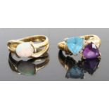 A modern 14ct gold and opal cabochon set dress ring, size N, together with a modern 14ct gold