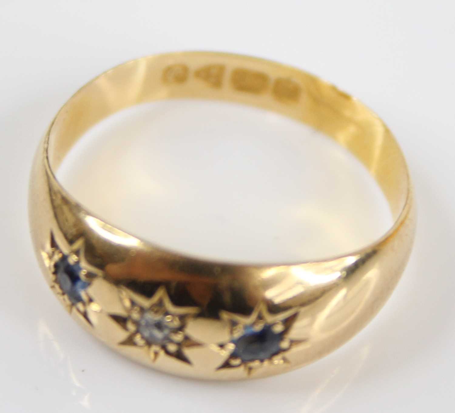 An Edwardian 18ct gold sapphire & diamond set band ring, the round cut stones each being gypsy - Image 5 of 7
