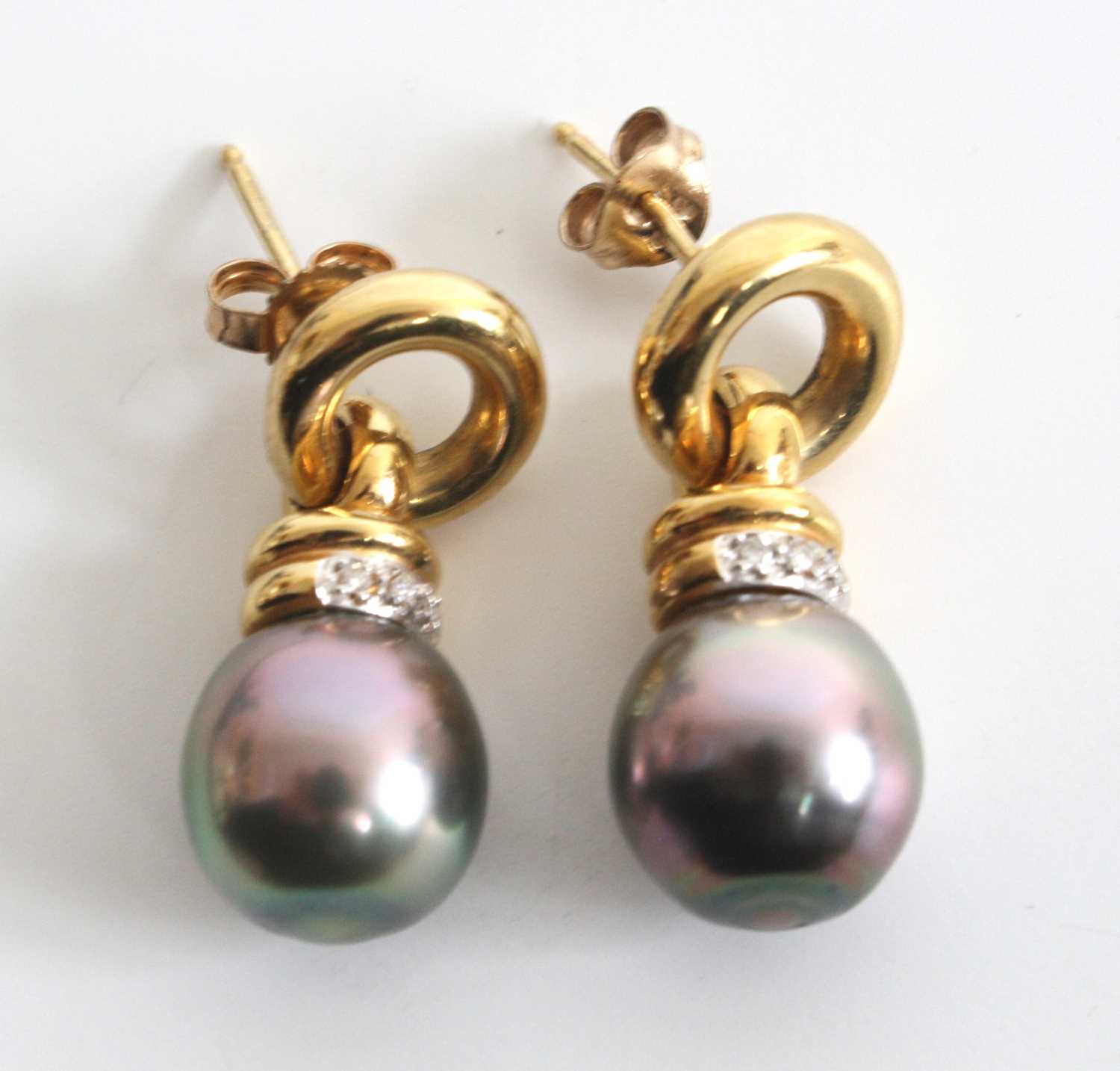 A pair of 18ct yellow gold, pearl and diamond drop earrings, each with a 10 x 9.8mm grey cultured