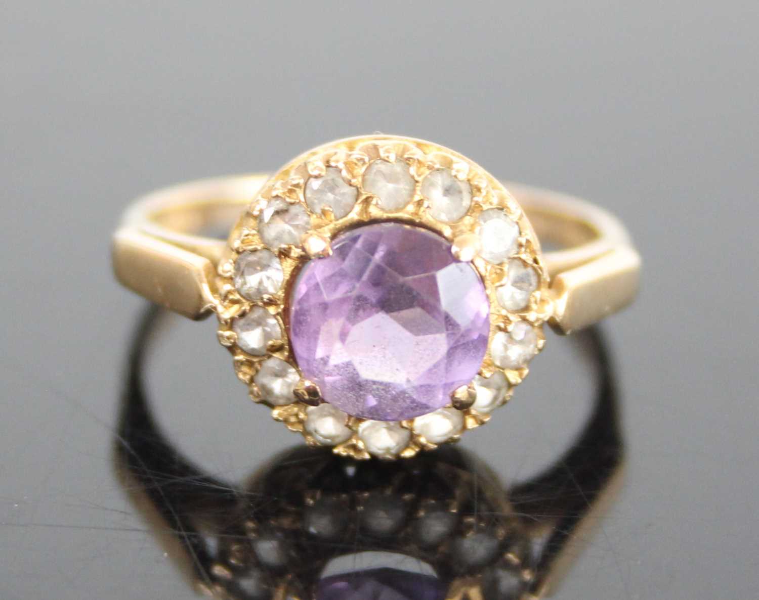 A 9ct yellow gold, amethyst and topaz circular cluster ring, having a centre round amethyst within a - Image 2 of 7