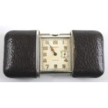 An Art Deco Movado Ermento steel and black leather cased travelling purse watch, having a signed