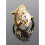 A modern 18ct gold diamond dress ring arranged as a four claw set brilliant, weighing approx 0.3ct