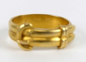 A yellow metal double strand buckle ring, width 5.1mm, size N½, gross weight 5.1g, not marked but