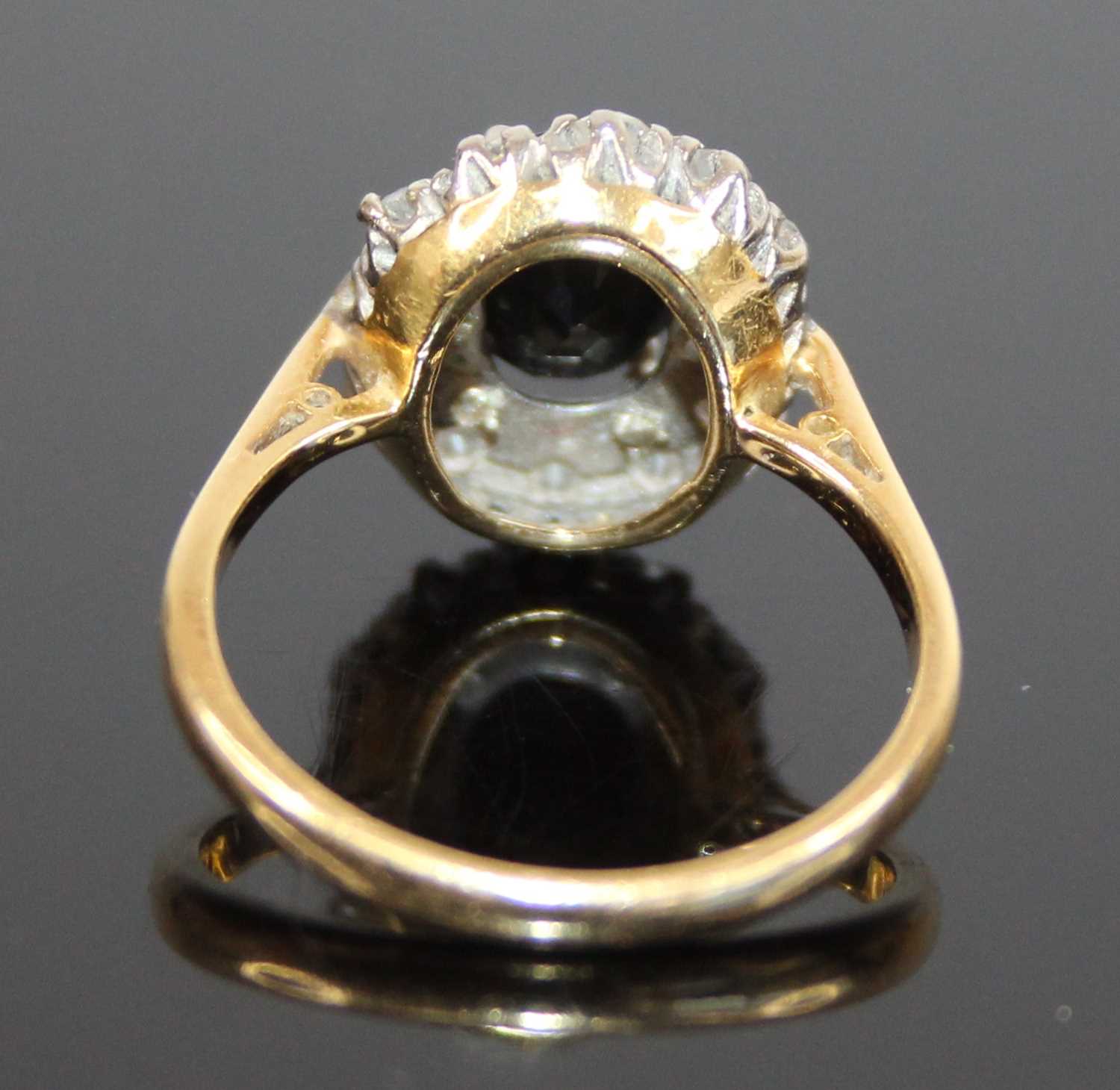 A yellow and white metal, sapphire and diamond oval cluster ring, the centre sapphire within a - Image 4 of 7