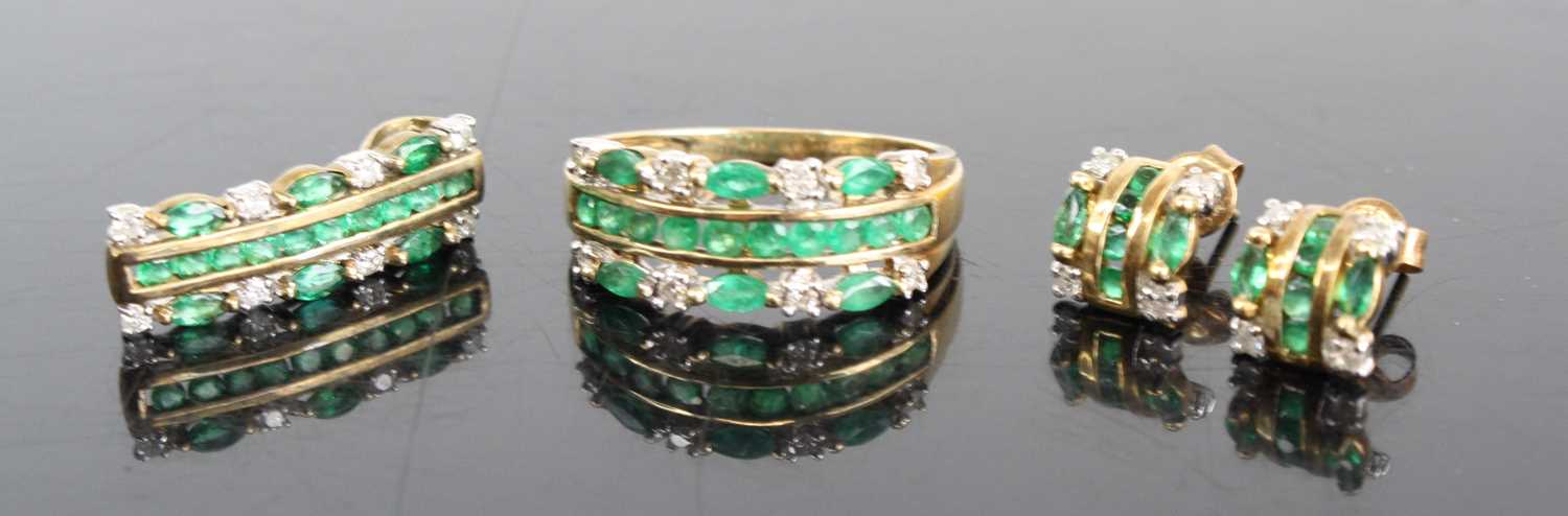 A 9ct gold emerald and diamond garniture comprising half hoop ring, pendant, and pair ear studs, the