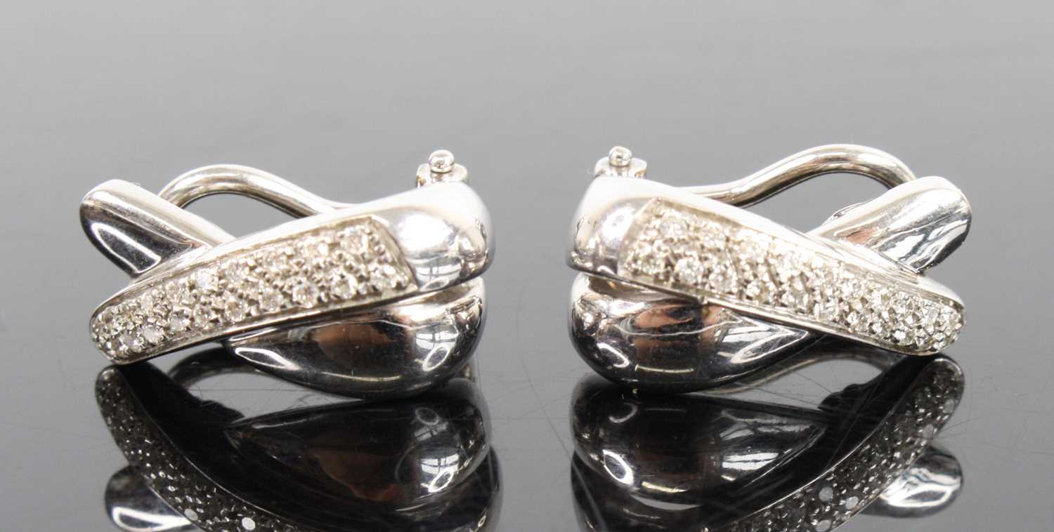 A pair of 18ct white gold diamond two-strand crossover clip earrings, each comprising a strand of 21 - Image 4 of 4