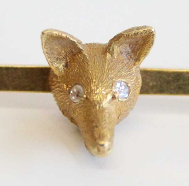 An 18ct gold safety pin bar brooch set with a fox's head, the eyes as two round cut diamonds, - Image 3 of 4