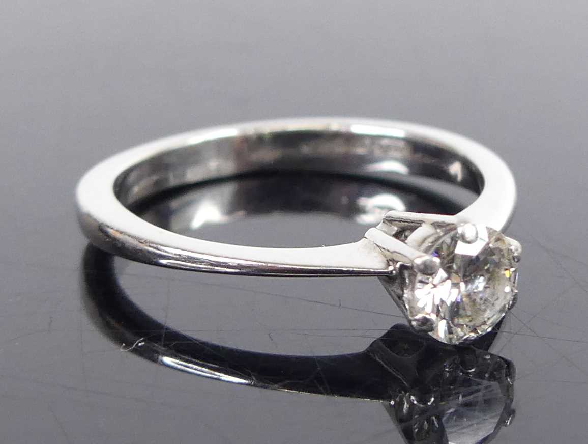 An 18ct white gold diamond solitaire ring, comprising a round brilliant cut diamond in six-claw