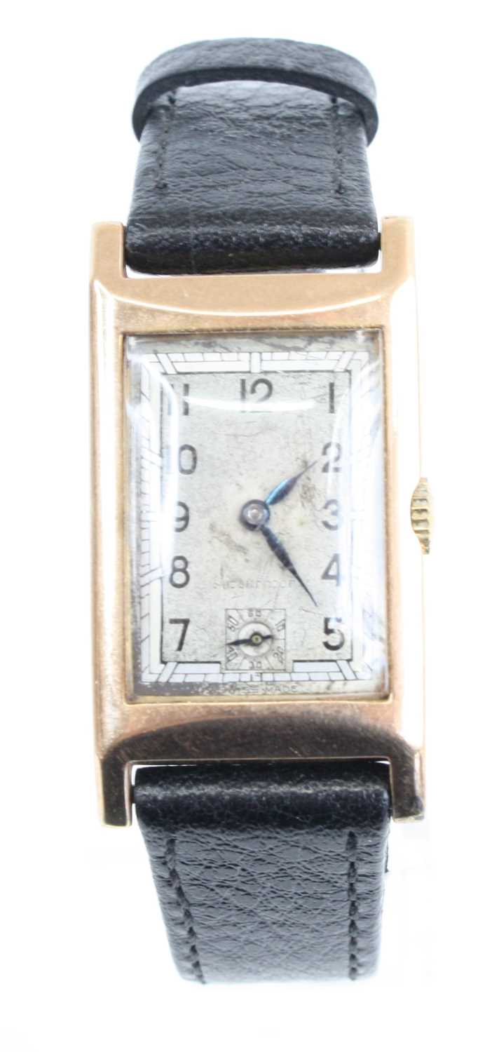 An Art Deco gent's 9ct gold cased tank watch having unsigned silvered dial with subsidiary seconds