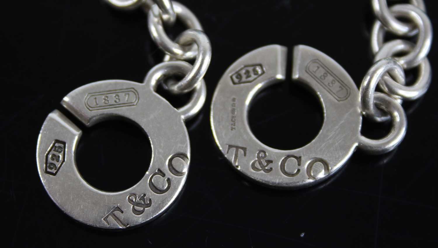 A Tiffany & Co silver bracelet, 19.5cm; together with two Tiffany & Co silver padlock clasps, - Image 2 of 6