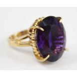 An impressive 18ct gold and Siberian amethyst set dress ring, of good size, the four-claw set oval